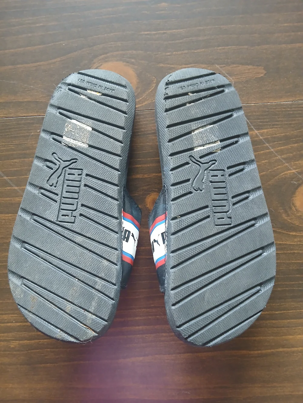 Puma Black Slide Sandal with Red, White & Blue Stripe